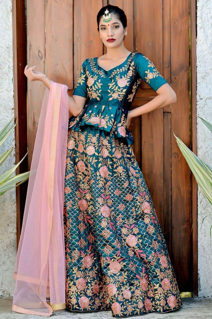 Teal Green peplum top and floral embroidered lehenga choli at Shopkund